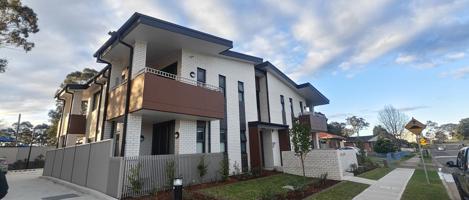 White-brick apartment building side elevation